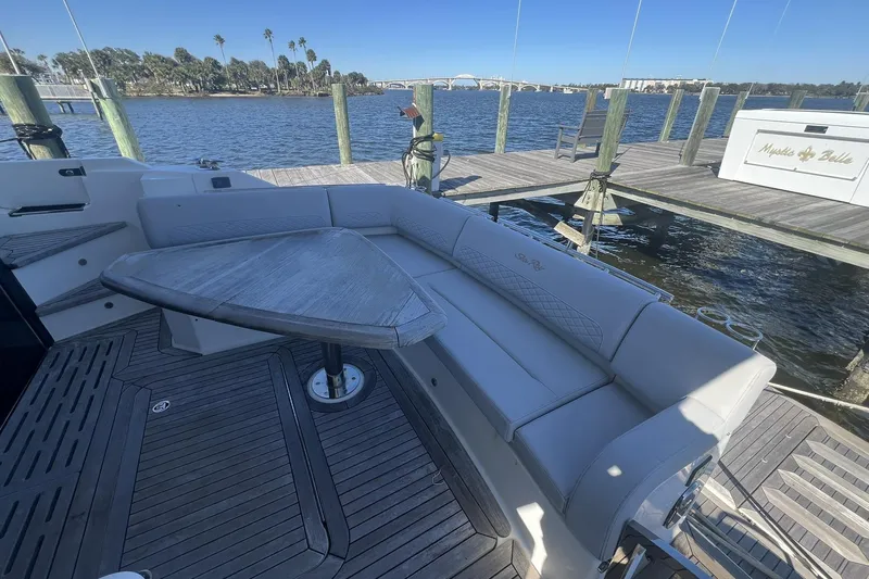 Slide: The Image of Engine compartment of a 2019 Sea Ray L550 yacht, showcasing mechanical components and wiring. - 106