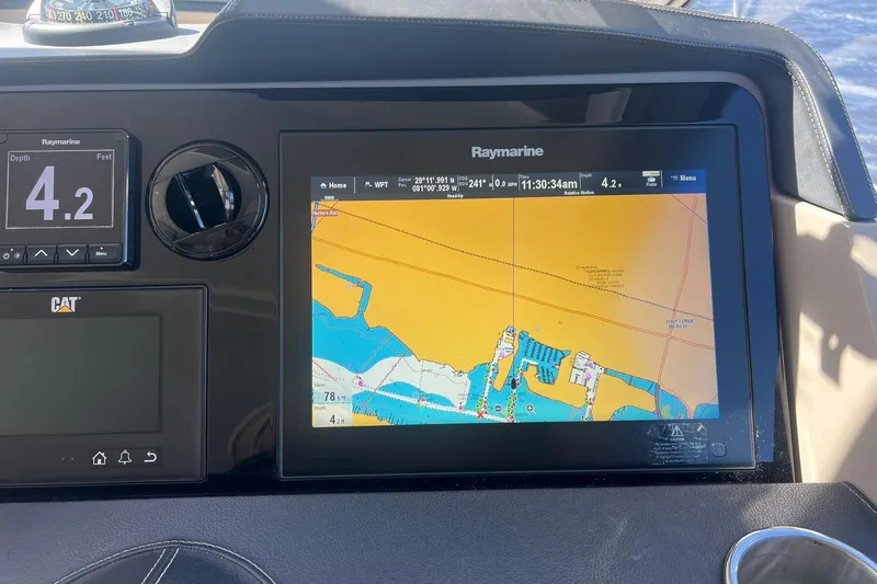 Slide: The Image of 2019 Sea Ray L550 yacht deck with built-in grill and seating area. - 19