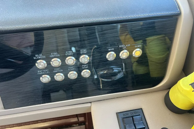 Slide: The Image of Staircase on 2019 Sea Ray L550 yacht with wooden steps and sleek design. - 23