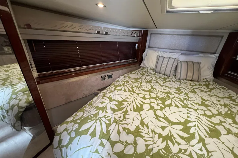 Slide: The Image of 2019 Sea Ray L550 yacht bow with anchor and railing over water. - 34