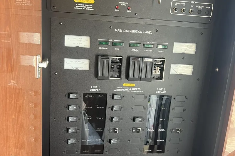 Slide: The Image of Control panel of a 2019 Sea Ray L550 yacht with various switches and buttons. - 40