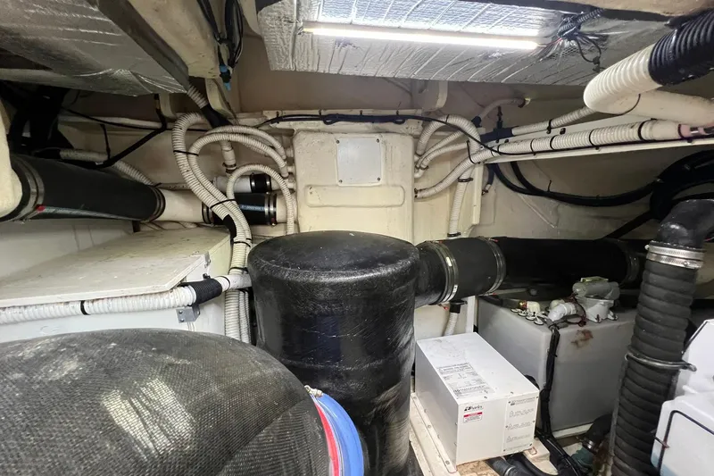 Slide: The Image of Luxurious interior of 2019 Sea Ray L550 yacht with modern kitchen and seating area. - 45