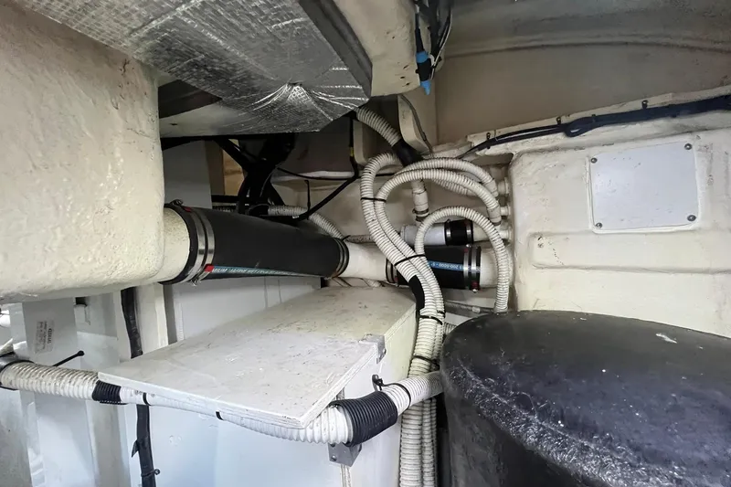 Slide: The Image of Luxurious 2019 Sea Ray L550 yacht kitchen with modern appliances and elegant wood cabinetry. - 47