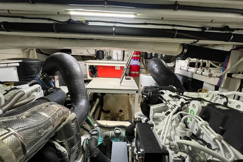 Slide: The Image of Luxurious 2019 Sea Ray L550 yacht bedroom with modern decor and ambient lighting. - 61