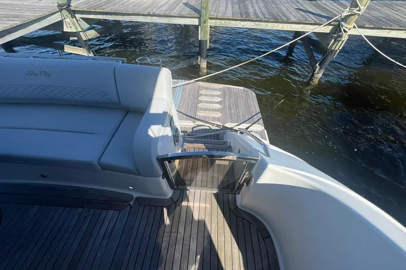 Slide: The Image of Engine room of a 2019 Sea Ray L550 yacht, showcasing dual engines and mechanical systems. - 82