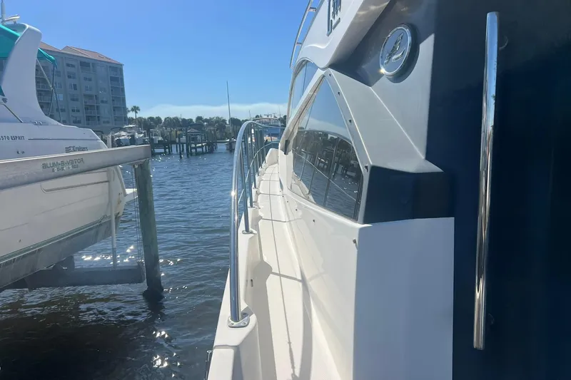 Slide: The Image of Engine room of 2019 Sea Ray L550 yacht with control panels and machinery. - 91