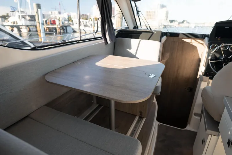 Slide: The Image of Manufacturer Provided Image: Interior of 2025 Bayliner Trophy T29 Explorer with seating and table. - 3
