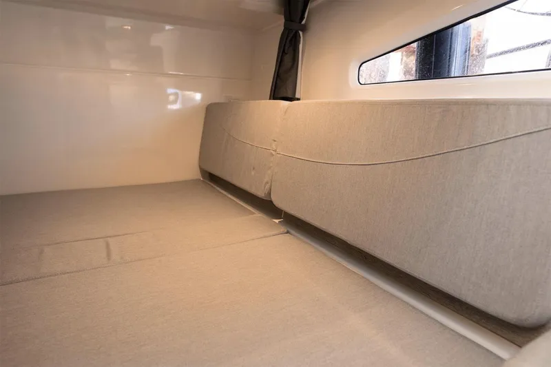 Slide: The Image of Manufacturer Provided Image: Interior cabin of 2025 Bayliner Trophy T29 Explorer, featuring comfortable seating and modern design. - 8