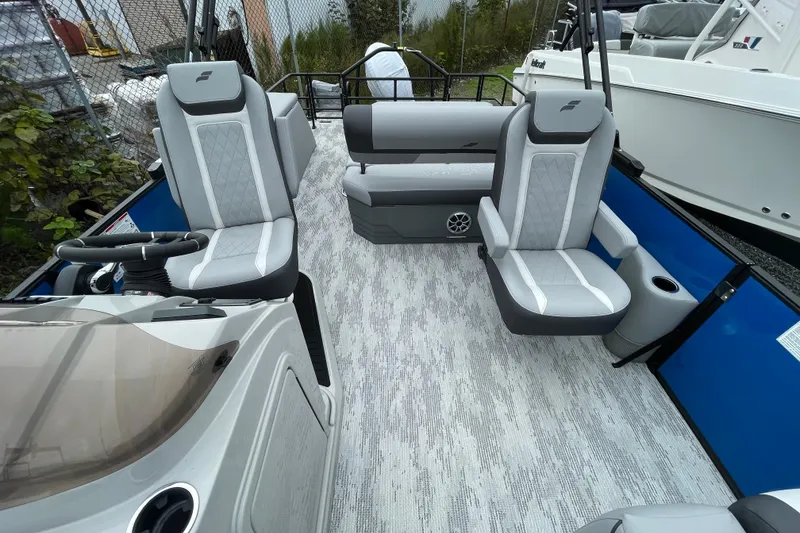 Slide: The Image of 2026 Starcraft EXS 3 DL boat interior with gray seating and modern design. - 4