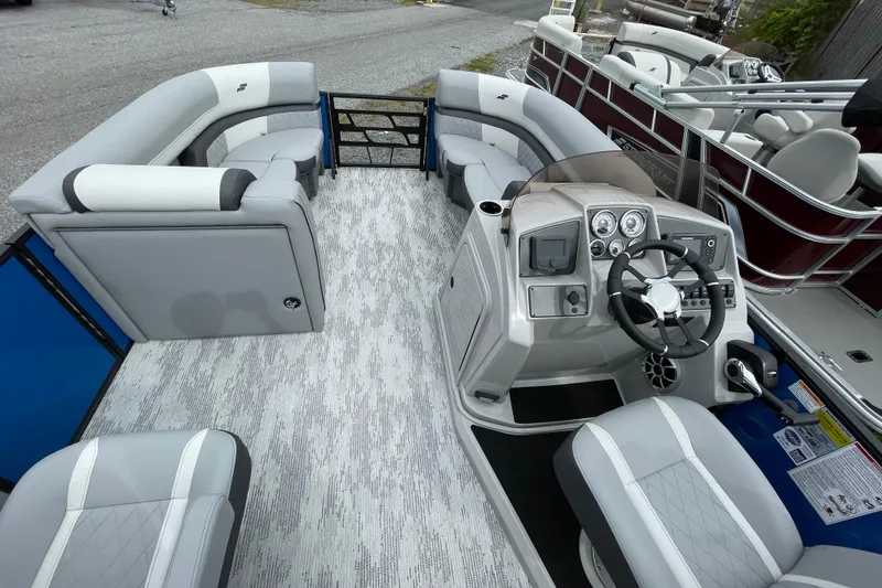 Slide: The Image of 2026 Starcraft EXS 3 DL pontoon boat interior with modern helm and seating. - 5