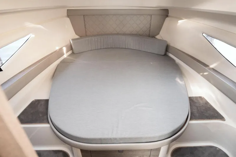 Slide: The Image of Manufacturer Provided Image: 2025 Bayliner Trophy T29 Explorer cabin interior with a cozy bed setup. - 12