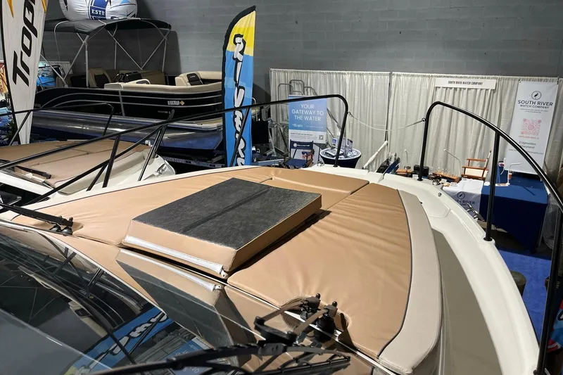 Slide: The Image of 2026 Bayliner Trophy T29 Explorer at a boat show, showcasing sleek design and comfort. - 15