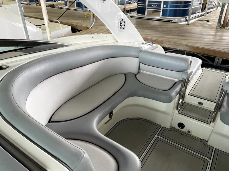 Slide: The Image of Luxurious seating area on a 2005 Cobalt 360 boat, featuring sleek gray upholstery. - 12