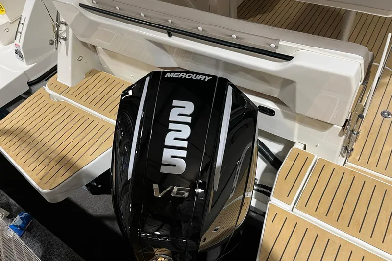 Slide: The Image of 2026 Bayliner Trophy T25 Explorer with Mercury V6 outboard engine and teak deck. - 14