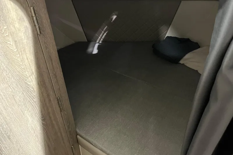 Slide: The Image of Cozy cabin interior of 2026 Bayliner Trophy T25 Explorer boat. - 18