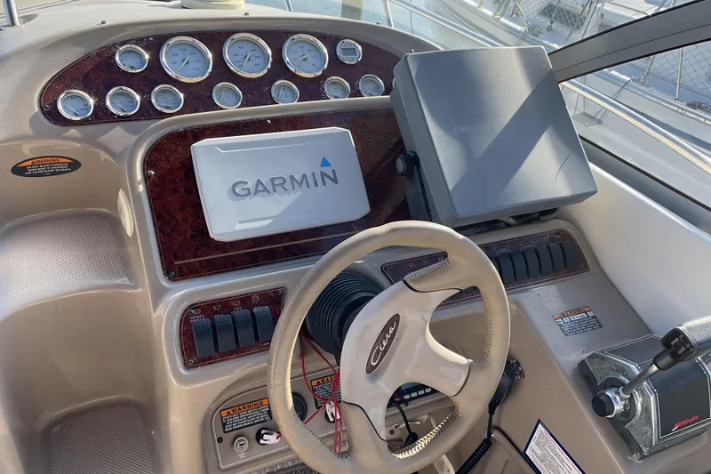 Slide: The Image of 2003 Bayliner 3055 Ciera helm with Garmin navigation and control panel. - 4