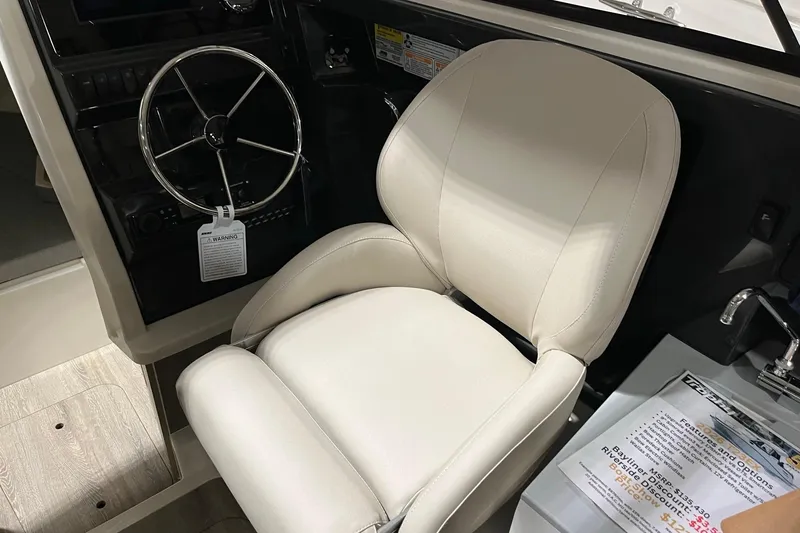 Slide: The Image of 2026 Bayliner Trophy T23 Explorer helm with steering wheel and captain's chair. - 10