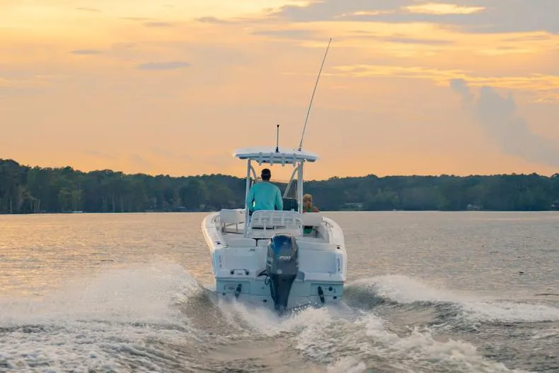 Slide: The Image of 2021 Sea Hunt Ultra 234 boat console with steering wheel and controls. - 3