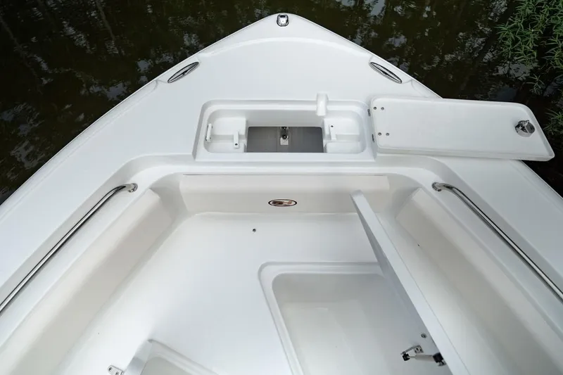 Slide: The Image of 2021 Sea Hunt Ultra 234 boat interior with seating and console. - 4