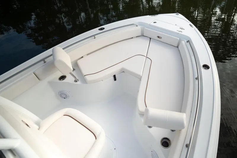 Slide: The Image of Interior storage compartment of 2021 Sea Hunt Ultra 234 boat, featuring various boating accessories. - 5