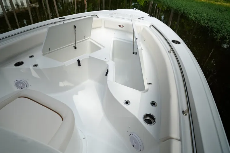 Slide: The Image of 2021 Sea Hunt Ultra 234 boat interior with seating and storage compartments. - 6