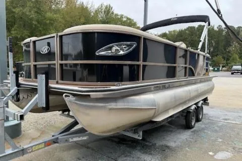 Slide: The Image of 2021 Bentley Pontoons 220 Elite Admiral on trailer, black exterior, parked outdoors. - 1