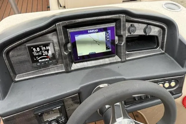 Slide: The Image of Dashboard of 2021 Bentley Pontoons 220 Elite Admiral with navigation and control displays. - 3