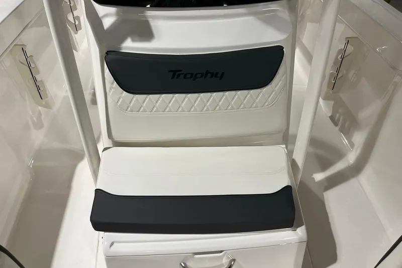 Slide: The Image of 2026 Bayliner Trophy T22CC boat seat with "Trophy" logo, featuring white and black upholstery. - 11