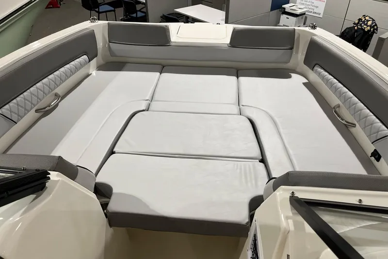 Slide: The Image of 2026 Bayliner D22 boat interior with cushioned seating and modern design. - 13