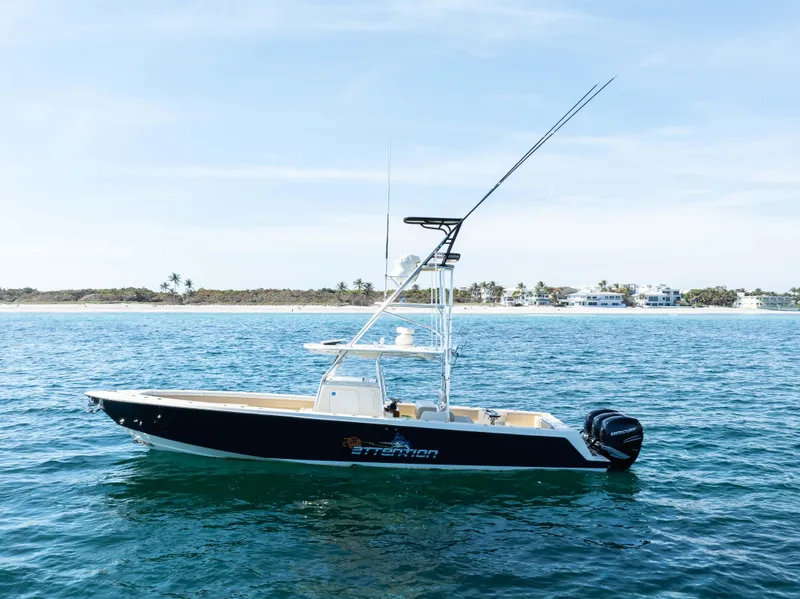 Slide: The Image of 2012 Contender 39 ST boat on calm ocean near shoreline. - 10