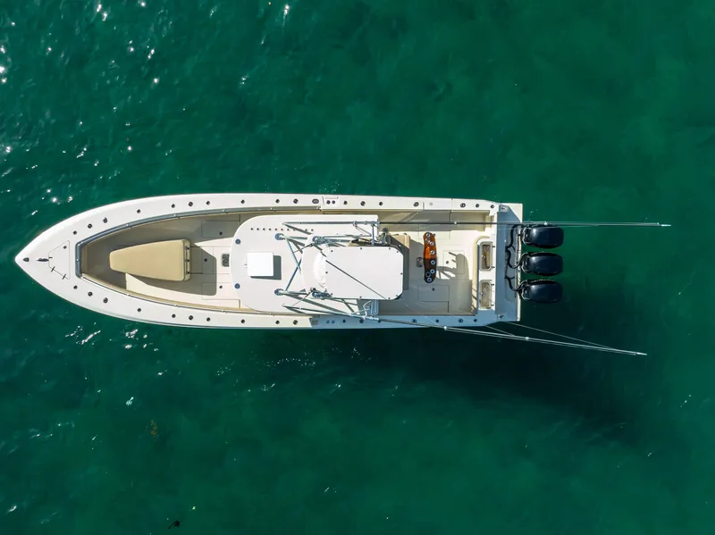 Slide: The Image of Aerial view of 2012 Contender 39 ST boat on clear turquoise water. - 11