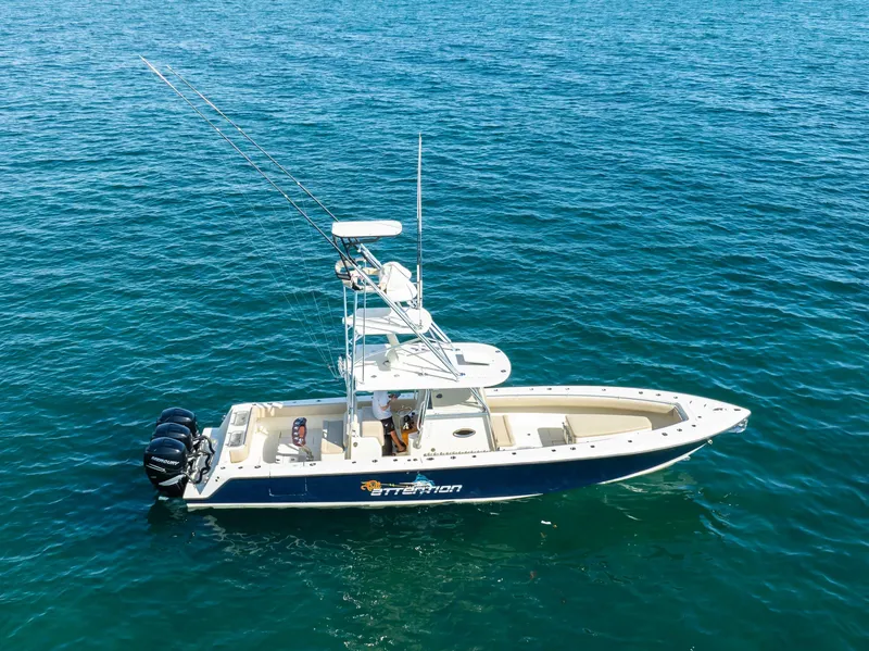 Slide: The Image of 2012 Contender 39 ST boat on open water, equipped with fishing gear. - 12