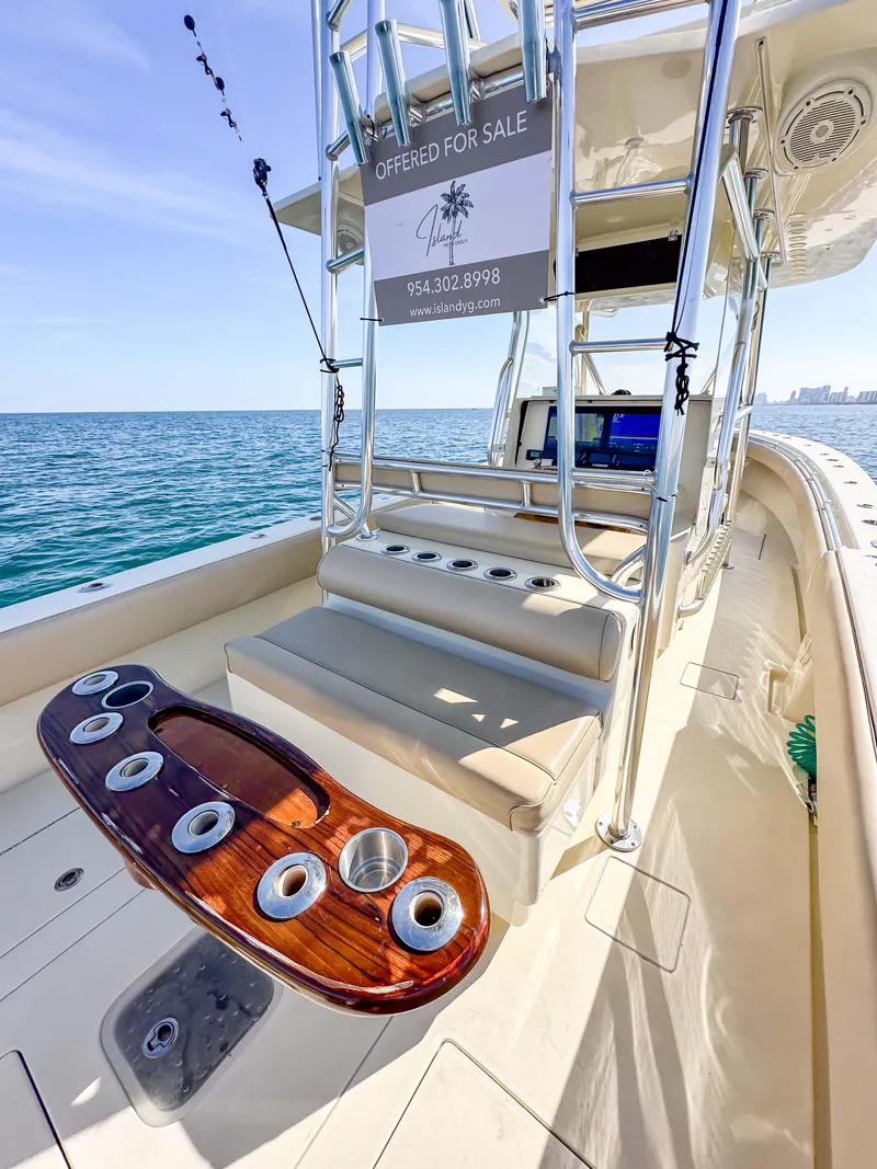 Slide: The Image of 2012 Contender 39 ST boat for sale, ocean view, luxury seating, and fishing rod holders. - 16