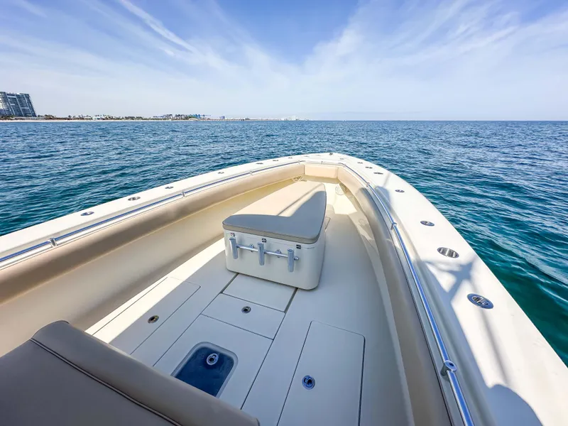 Slide: The Image of 2012 Contender 39 ST boat on open sea, clear sky, spacious deck. - 24