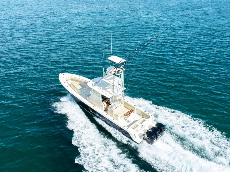 Slide: The Image of 2012 Contender 39 ST boat cruising on open water, aerial view. - 6