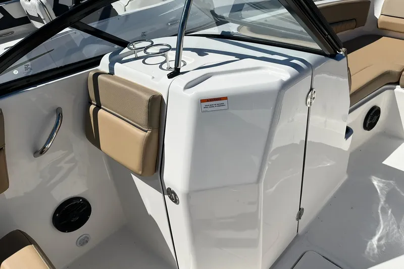 Slide: The Image of 2026 Bayliner D22 boat interior with beige seating and sleek design. - 11