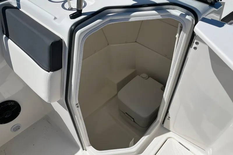 Slide: The Image of 2026 Bayliner D22 boat interior with compact marine toilet. - 12