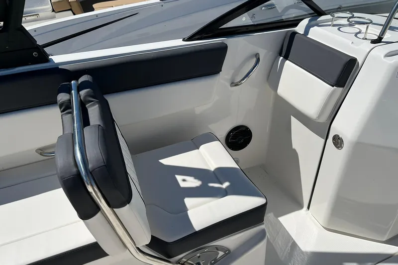 Slide: The Image of 2026 Bayliner D22 boat interior with white seating and stainless steel accents. - 9
