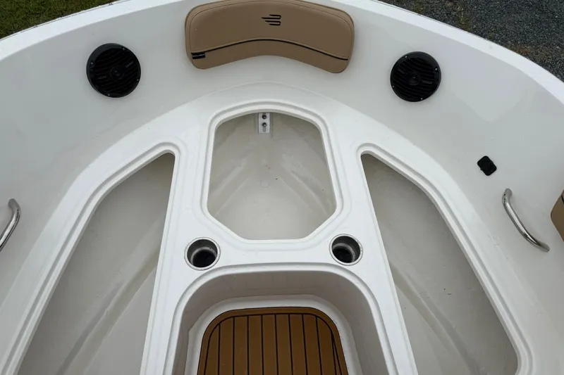 Slide: The Image of 2025 Bayliner VR6 Bowrider I/O boat interior with speakers and seating. - 13