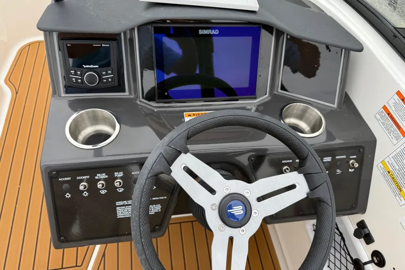 Slide: The Image of 2025 Bayliner VR6 Bowrider I/O engine compartment with open hatch, showcasing the engine. - 7
