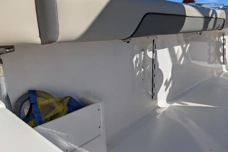Slide: The Image of Interior view of 2025 Key West 239 FS boat, featuring seating and storage area. - 11