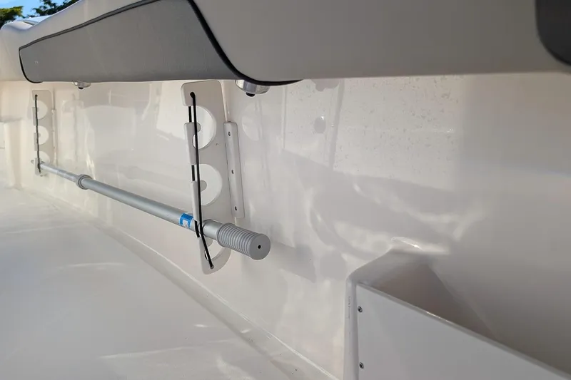 Slide: The Image of 2025 Key West 239 FS boat interior detail with mounted rod holder. - 12