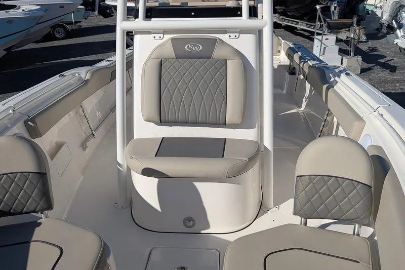 Slide: The Image of 2025 Key West 239 FS boat interior with gray cushioned seating and sleek design. - 17