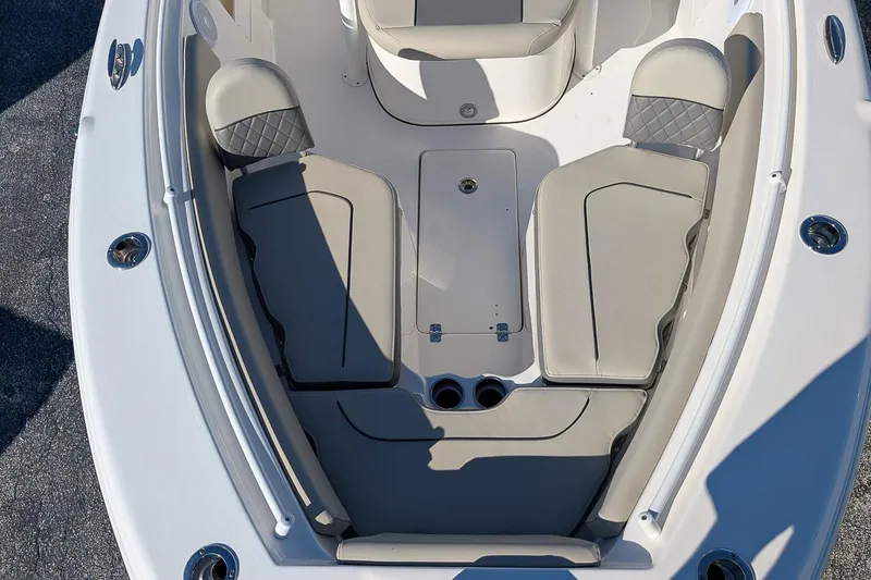 Slide: The Image of 2025 Key West 239 FS boat interior with cushioned seating and storage compartments. - 18