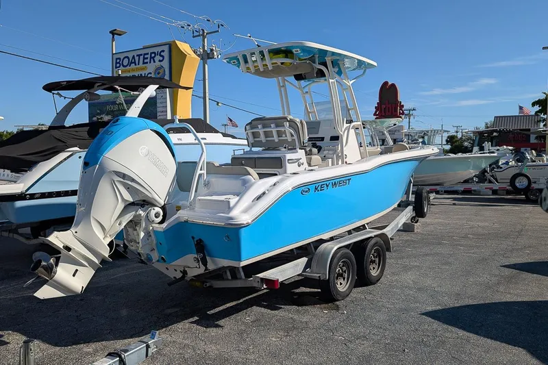 Slide: The Image of 2025 Key West 239 FS boat on trailer at dealership, featuring Yamaha outboard motor. - 3