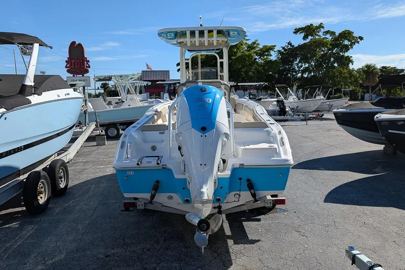 Slide: The Image of 2025 Key West 239 FS boat in a marina, rear view, sunny day. - 4