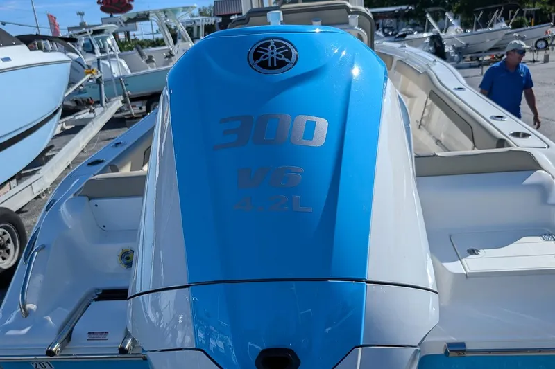 Slide: The Image of 2025 Key West 239 FS boat with Yamaha 300 V6 4.2L engine in marina. - 5