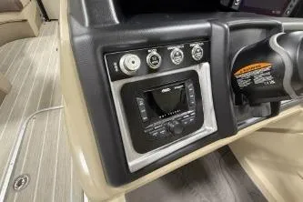 Slide: The Image of 2025 Berkshire 23ULESTS3-93 boat dashboard with control panel and steering wheel. - 14