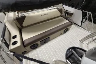 Slide: The Image of 2025 Berkshire 23ULESTS3-93 boat interior with beige seating and modern design. - 20