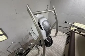 Slide: The Image of 2025 Berkshire 23ULESTS3-93 boat engine with sleek metallic frame in a workshop setting. - 23